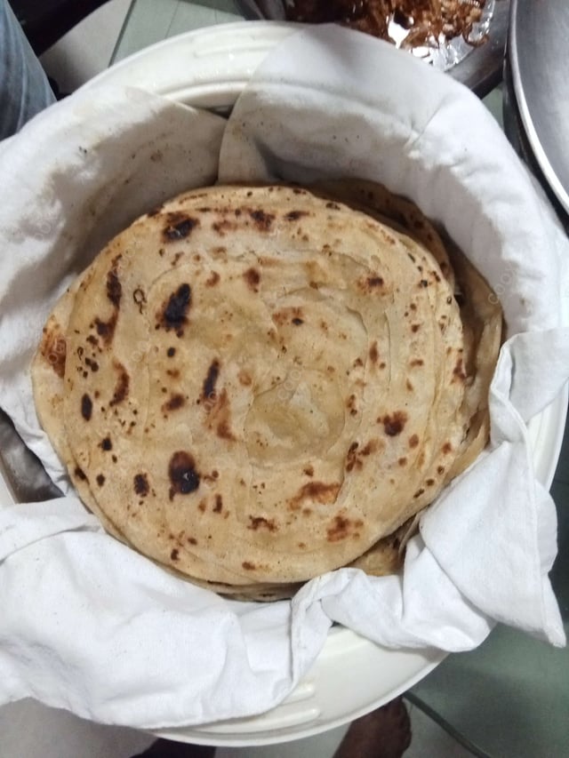 Delicious Lachha Parathas prepared by COOX