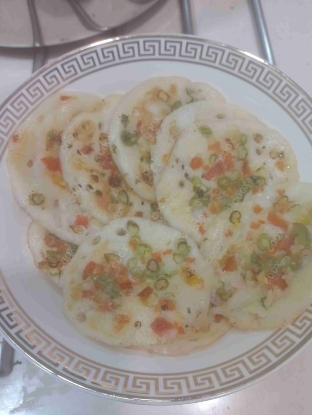 Delicious Mixed Veg Uttappam prepared by COOX