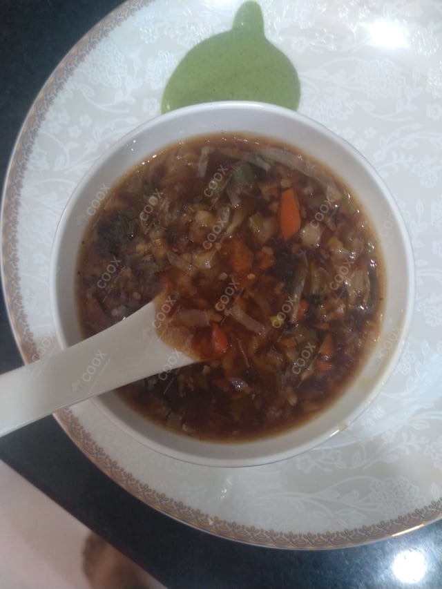 Delicious Vegetable Manchow Soup prepared by COOX