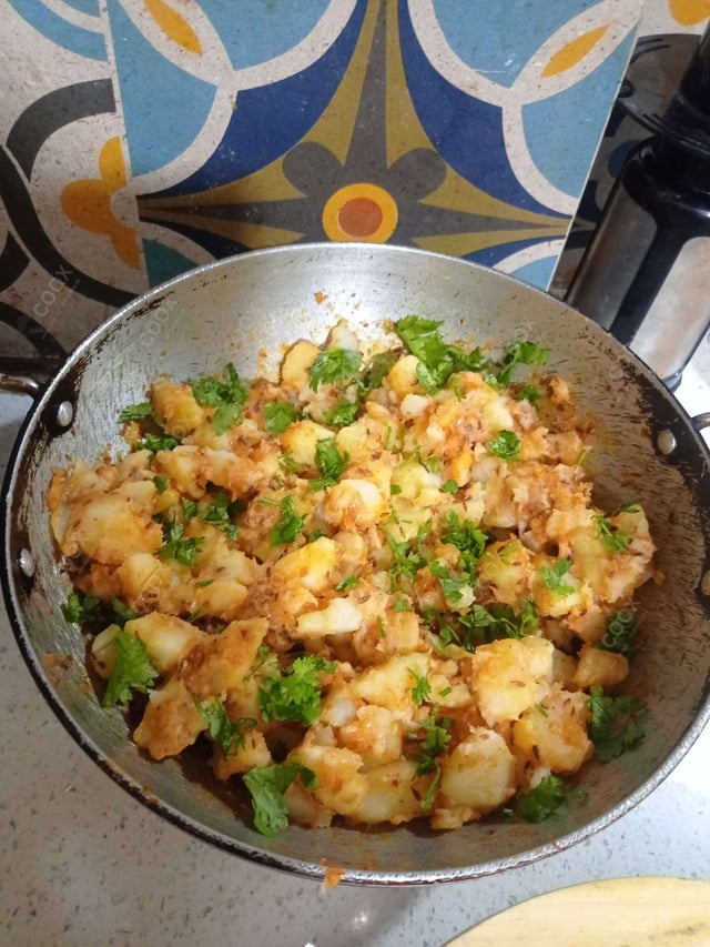 Delicious Jeera Aloo prepared by COOX