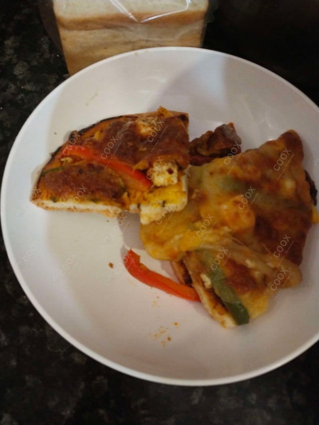 Delicious Veg Pizza prepared by COOX