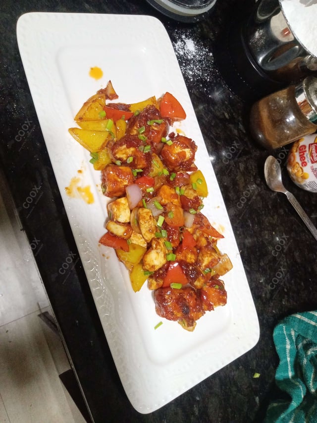 Delicious Chilli Paneer (Dry) prepared by COOX