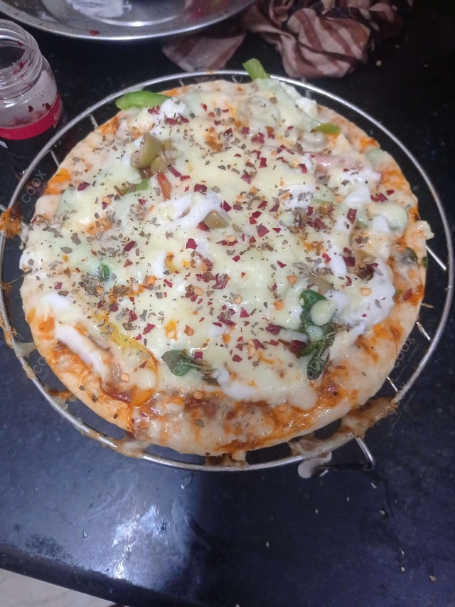 Delicious Veg Pizza prepared by COOX