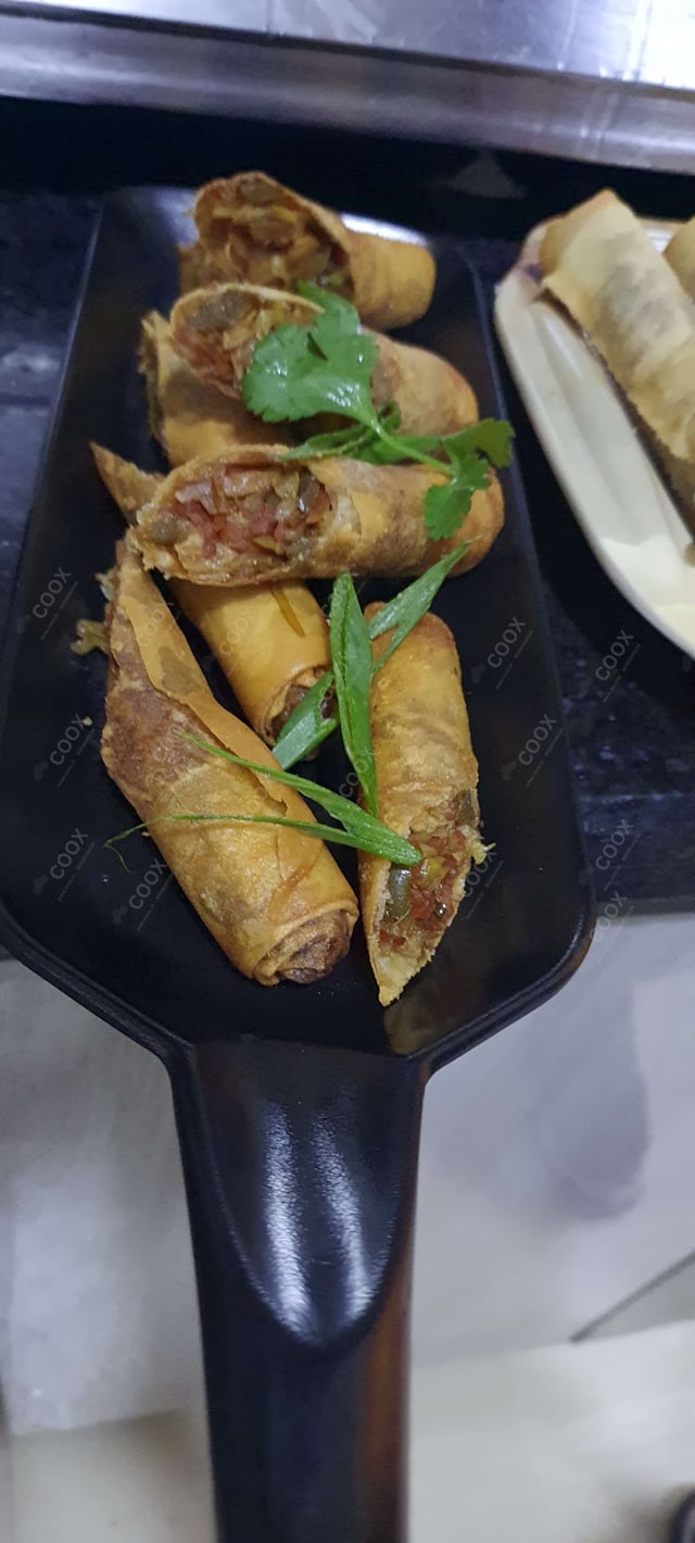 Delicious Veg Spring Rolls prepared by COOX