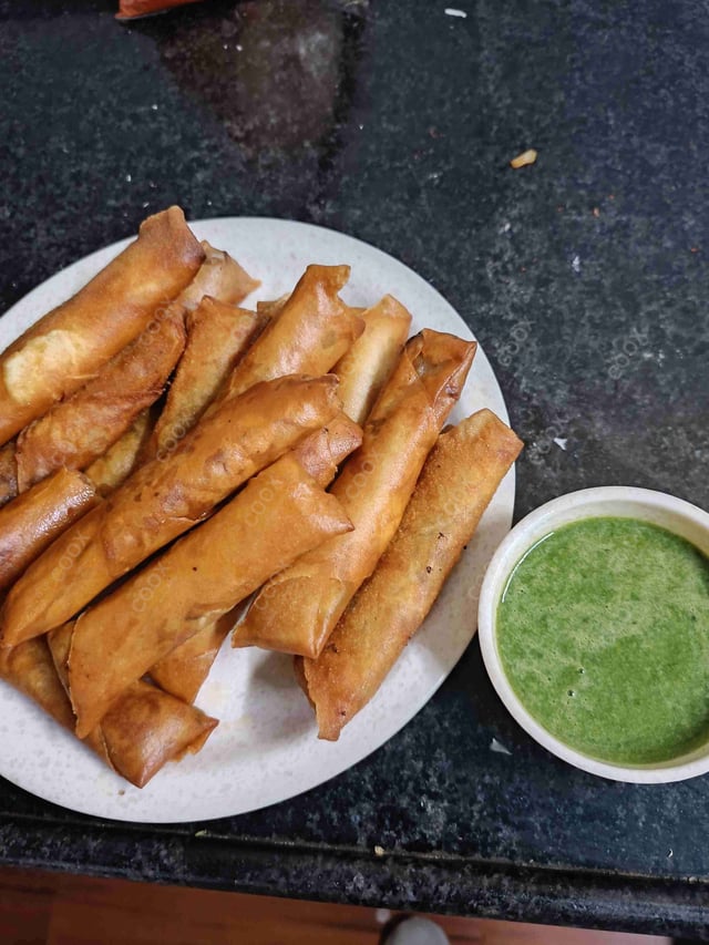 Delicious Veg Spring Rolls prepared by COOX