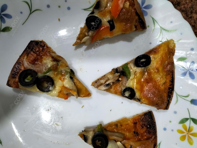 Delicious Veg Pizza prepared by COOX