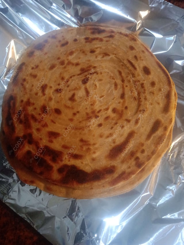 Delicious Lachha Parathas prepared by COOX