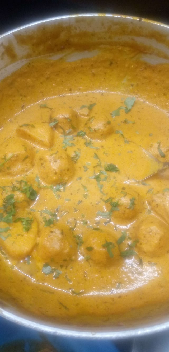 Delicious Dum Aloo prepared by COOX