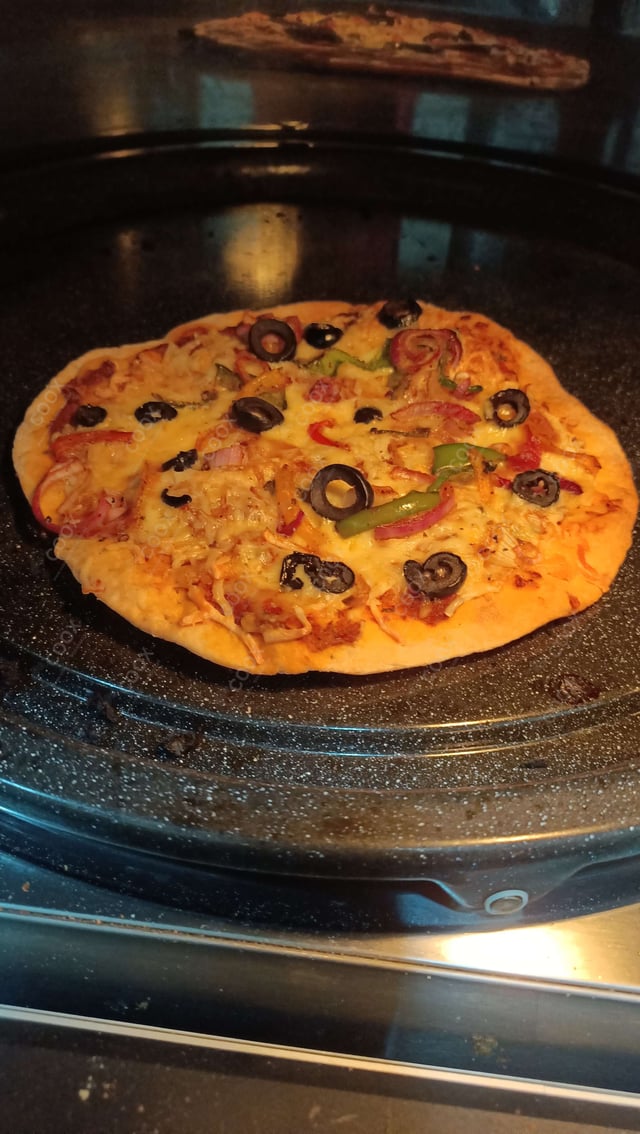 Delicious Veg Pizza prepared by COOX