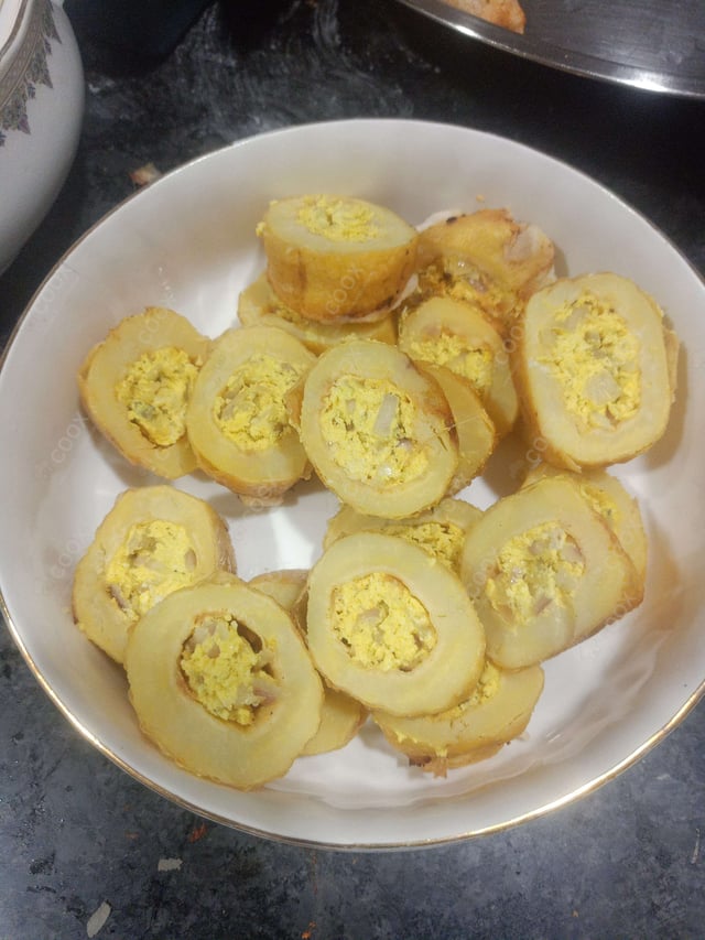 Delicious Stuffed Potatoes (Gravy) prepared by COOX