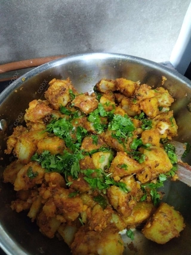 Delicious Jeera Aloo prepared by COOX