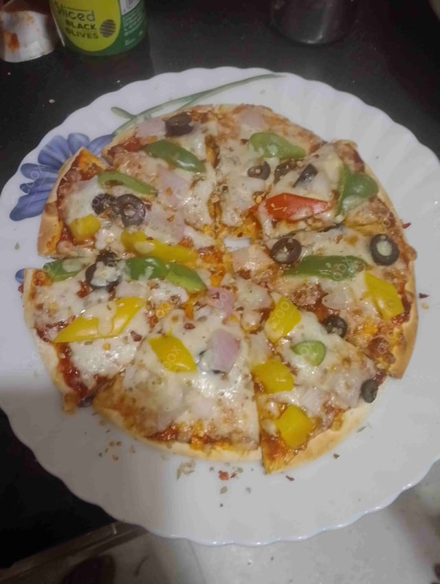 Delicious Veg Pizza prepared by COOX