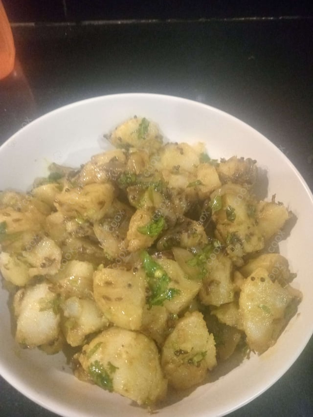 Delicious Jeera Aloo prepared by COOX