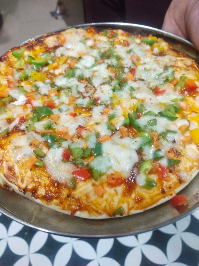 Delicious Veg Pizza prepared by COOX