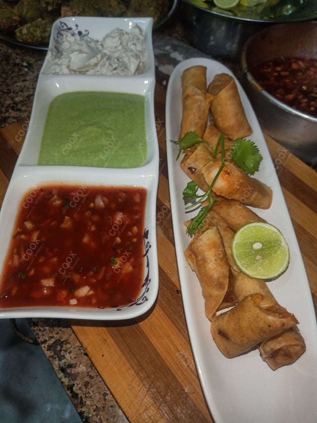 Delicious Veg Spring Rolls prepared by COOX