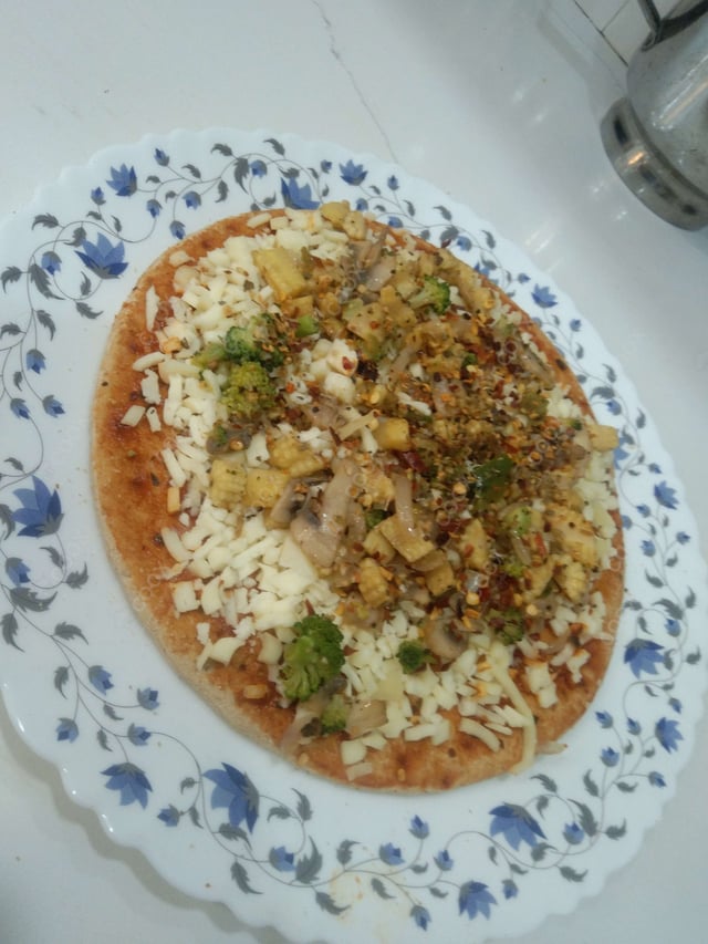 Delicious Veg Pizza prepared by COOX