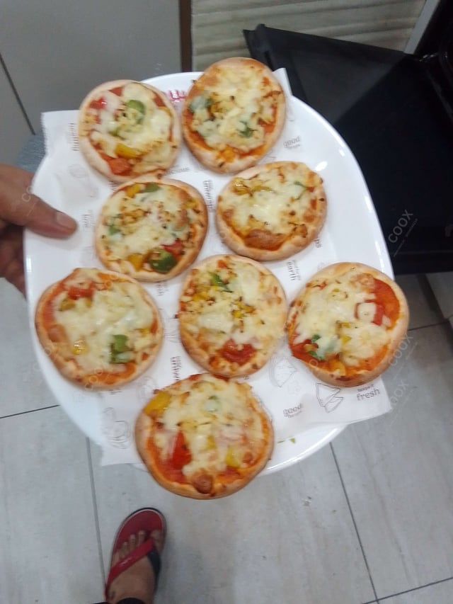 Delicious Veg Pizza prepared by COOX