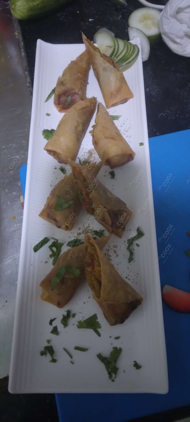 Delicious Veg Spring Rolls prepared by COOX