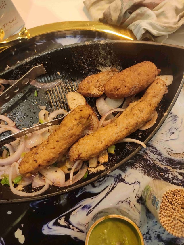 Delicious Mutton Seekh Kebab prepared by COOX