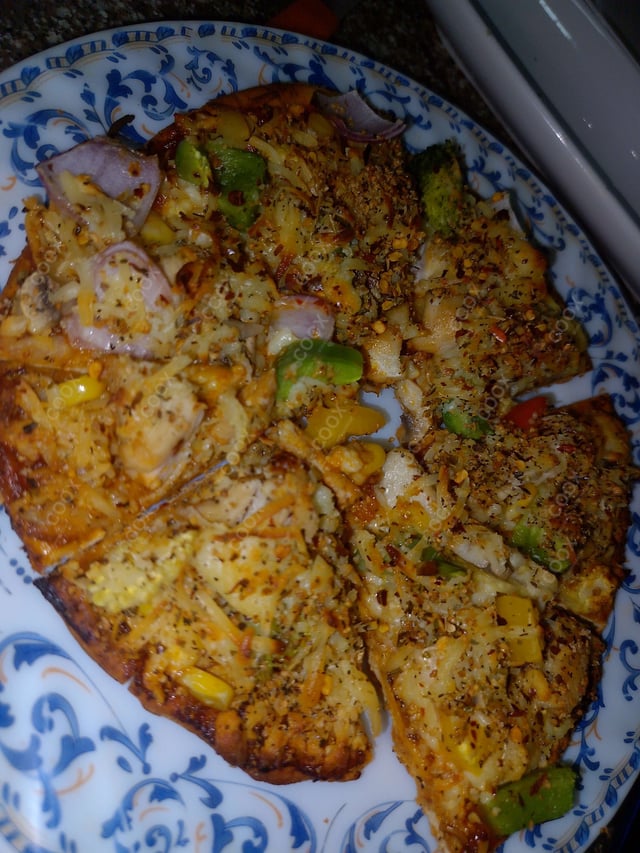 Delicious Chicken Pizza prepared by COOX