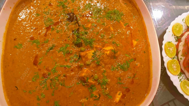 Delicious Matar Paneer prepared by COOX