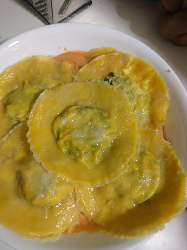 Delicious Ravioli in Pink Sauce prepared by COOX