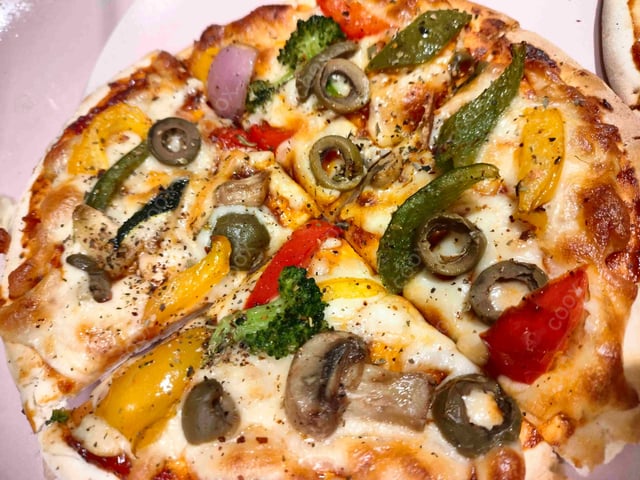 Delicious Veg Pizza prepared by COOX