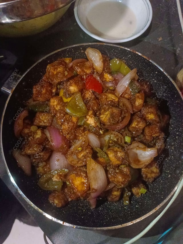 Delicious Chilli Paneer (Dry) prepared by COOX