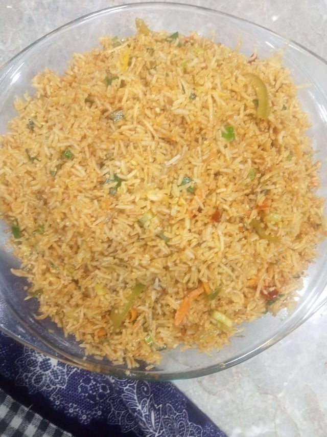 Delicious Schezwan Fried Rice prepared by COOX