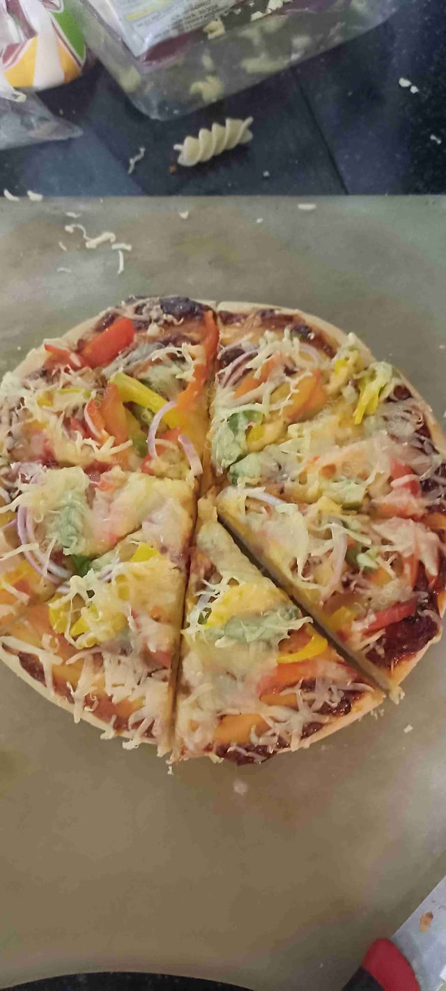 Delicious Veg Pizza prepared by COOX