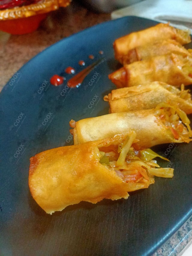 Delicious Veg Spring Rolls prepared by COOX