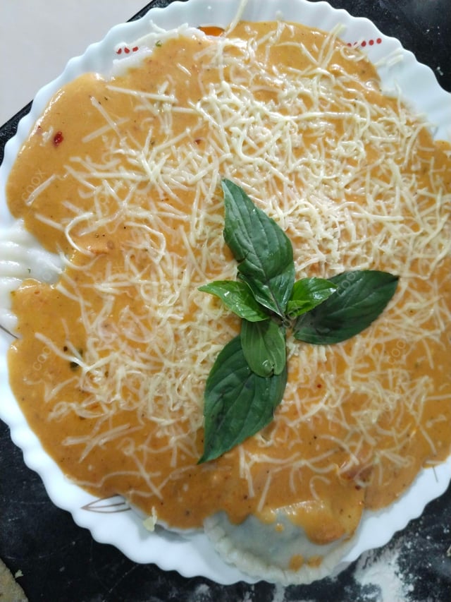 Delicious Ravioli in Pink Sauce prepared by COOX