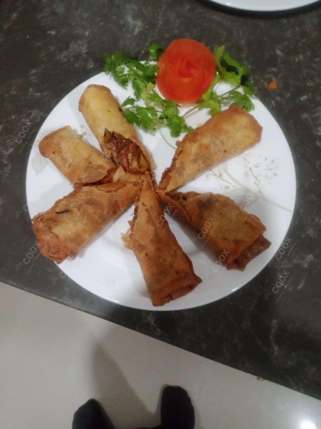 Delicious Veg Spring Rolls prepared by COOX