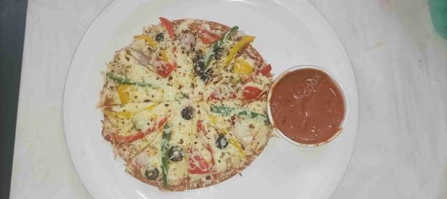 Delicious Veg Pizza prepared by COOX