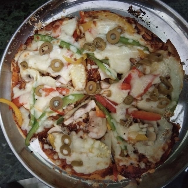 Delicious Classic Veg Pizza prepared by COOX