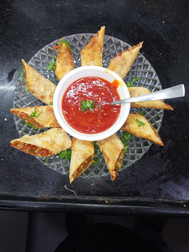 Delicious Veg Spring Rolls prepared by COOX