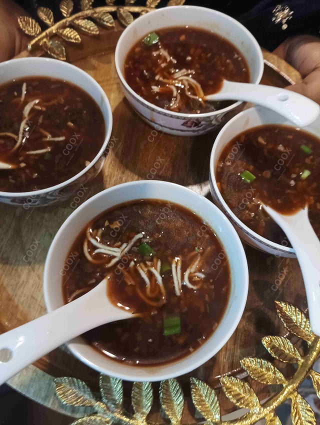 Delicious Vegetable Manchow Soup prepared by COOX