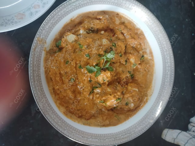 Delicious Paneer Butter Masala prepared by COOX