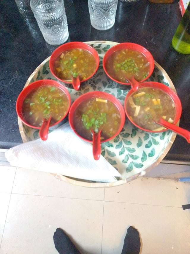 Delicious Vegetable Manchow Soup prepared by COOX