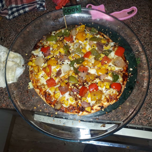 Delicious Veg Pizza prepared by COOX