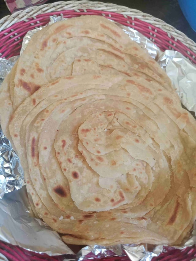 Delicious Lachha Parathas prepared by COOX