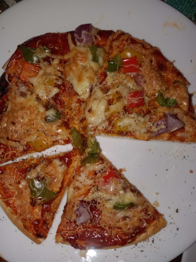 Delicious Chicken Pizza prepared by COOX