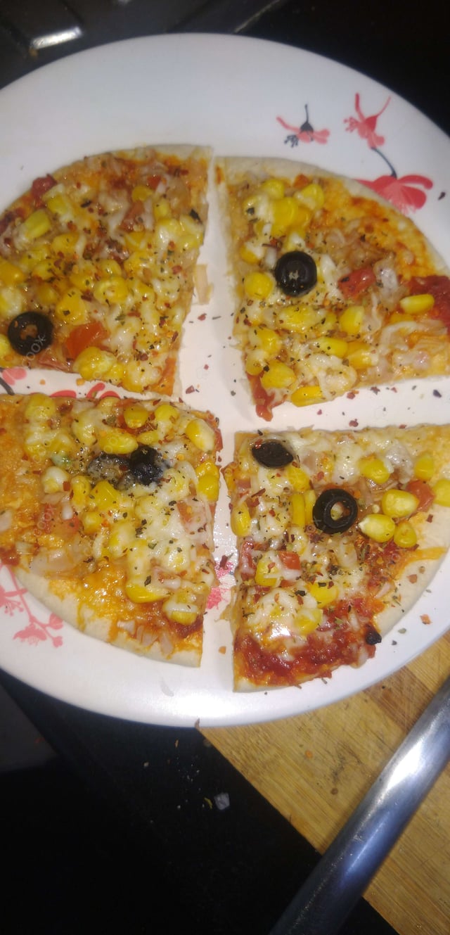 Delicious Veg Pizza prepared by COOX