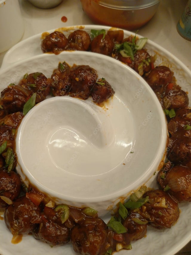 Delicious Veg Manchurian (Dry) prepared by COOX