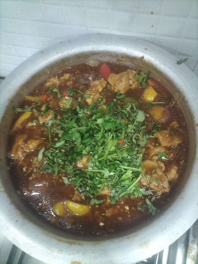 Delicious Chicken in Schezwan Sauce prepared by COOX