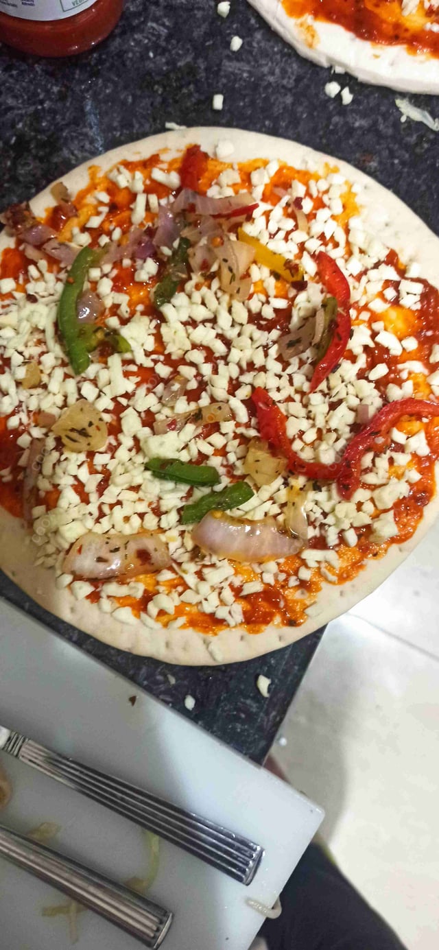 Delicious Veg Pizza prepared by COOX