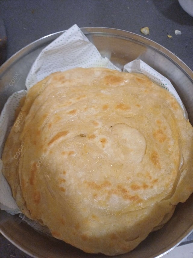 Delicious Lachha Parathas prepared by COOX