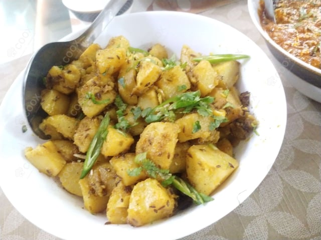 Delicious Jeera Aloo prepared by COOX