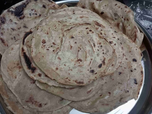 Delicious Lachha Parathas prepared by COOX