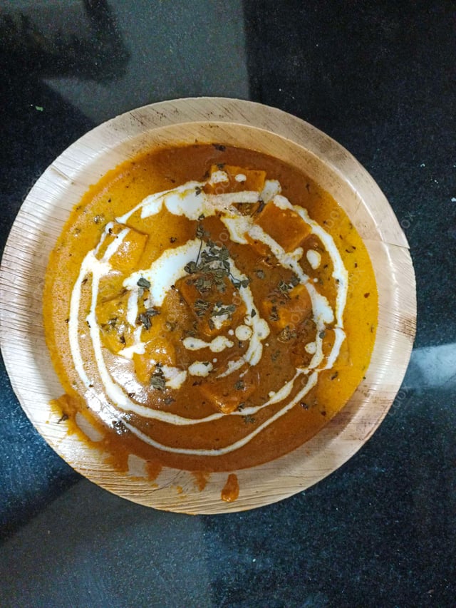 Delicious Paneer Butter Masala prepared by COOX